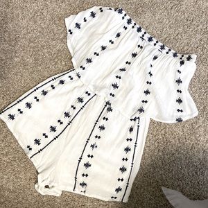 white romper with blue embroidery